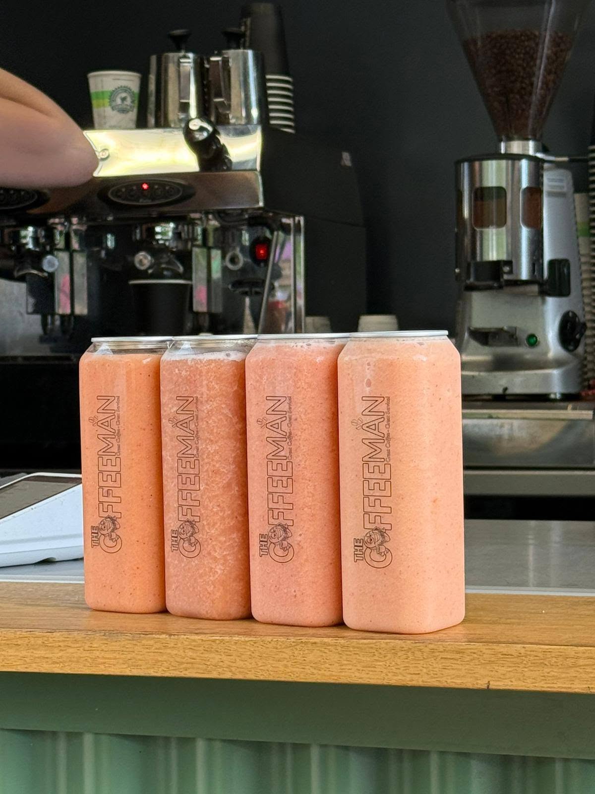 Fresh smoothies in sealed cans from a festival coffee van